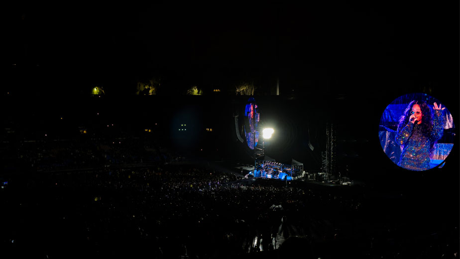 H.E.R. performing at the Rose Bowl during Coldplay's Music of the Spheres tour.