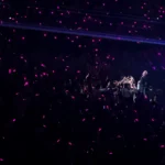 G-Dragon staring into the sea of lights during night 2 of the 'Übermensch World Tour' at Crypto Arena in Los Angeles.