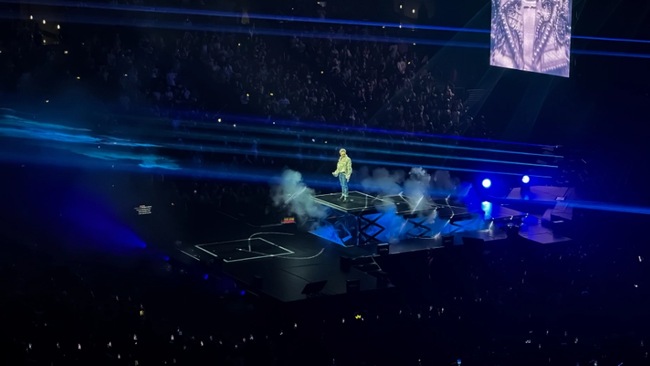 G-Dragon walks the floating steps on his stage to get a better view of his fans.