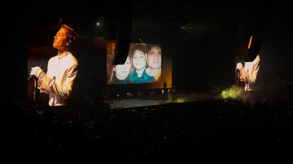 Jacksong Wang gets emotional while looking at a photo of his childhood during the 'MAGICMAN 2 World Tour.'